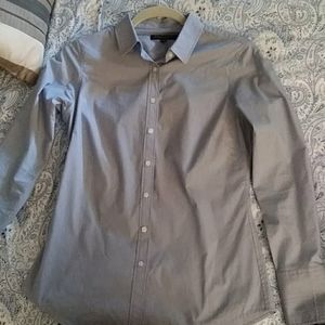 Blue button down shirt.